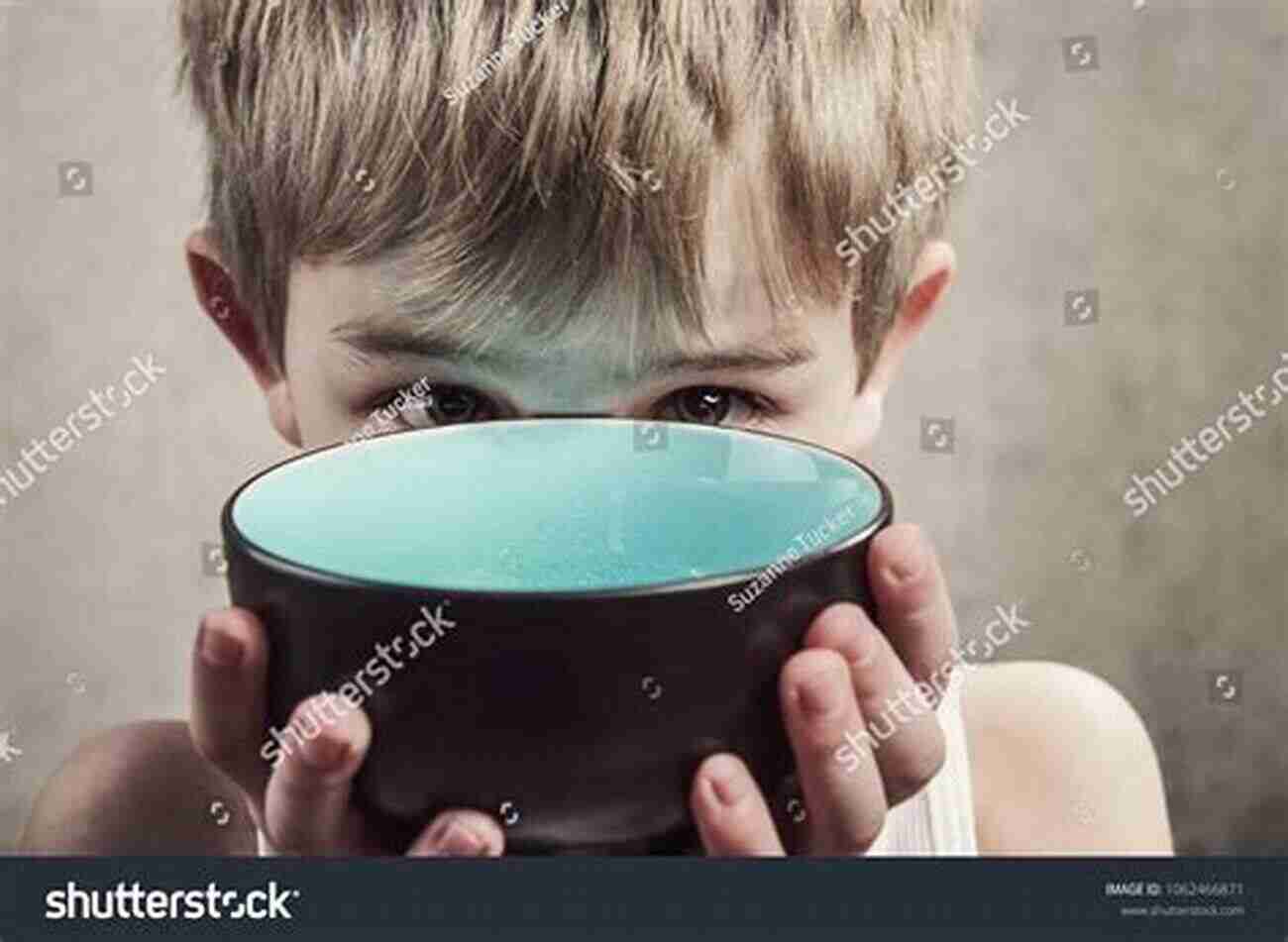 A Child Holding An Empty Bowl, Symbolizing Hunger Beginning To End Hunger: Food And The Environment In Belo Horizonte Brazil And Beyond (Fletcher Jones Foundation)