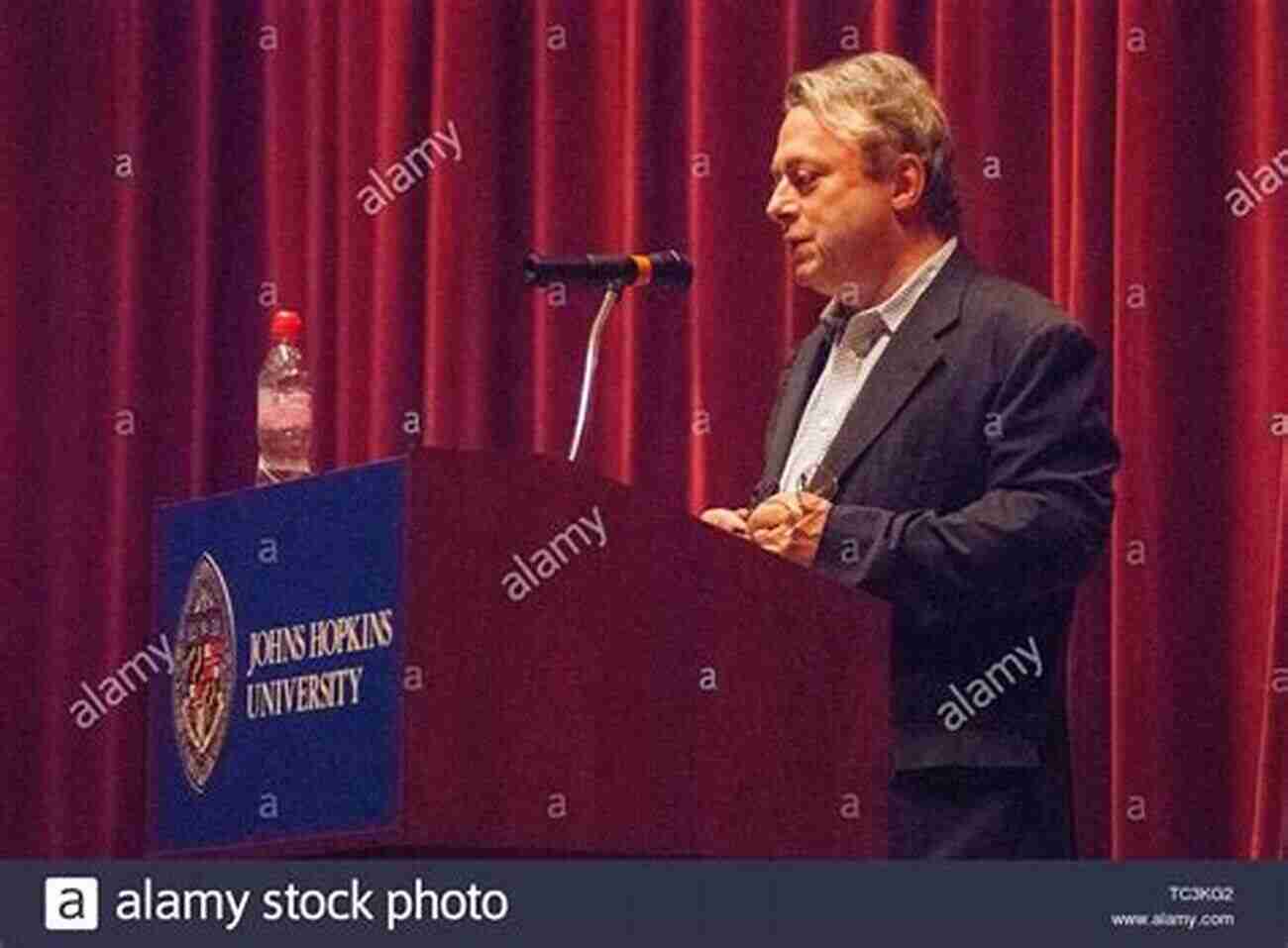 Christopher Hitchens Standing At A Podium Delivering An Impassioned Speech. Christopher Hitchens And His Critics: Terror Iraq And The Left