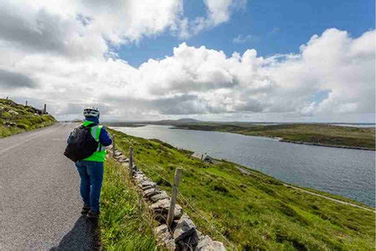 Cyclist Admiring The Dramatic Coastline Of Northumberland Lost Lanes North: 36 Glorious Bike Rides In Yorkshire Lake District Northumberland Pennines And Northern England