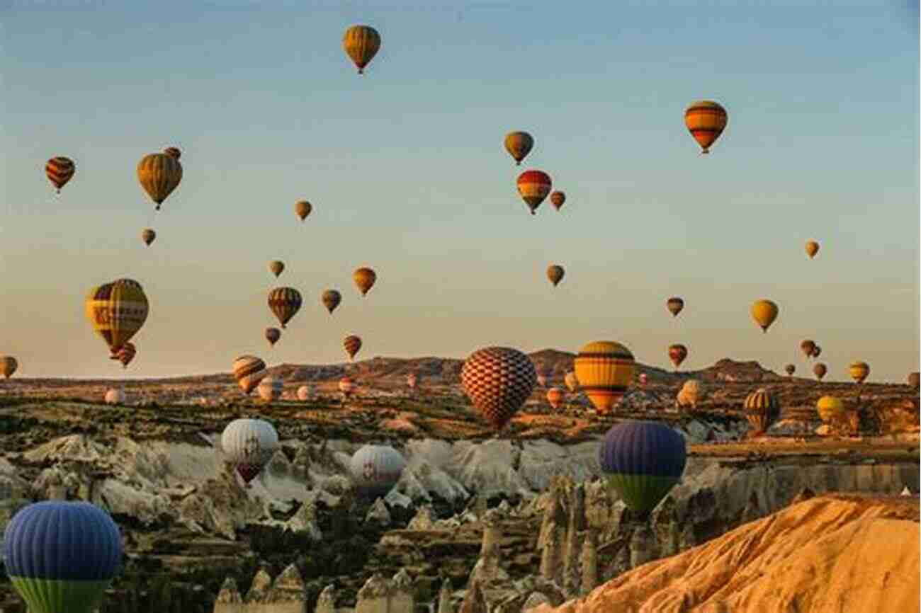 Hot Air Balloon Soaring Over The Surreal Landscapes Of Cappadocia At Sunrise My Cappadocia Trip: Cappadocia Perfect Guide Photo