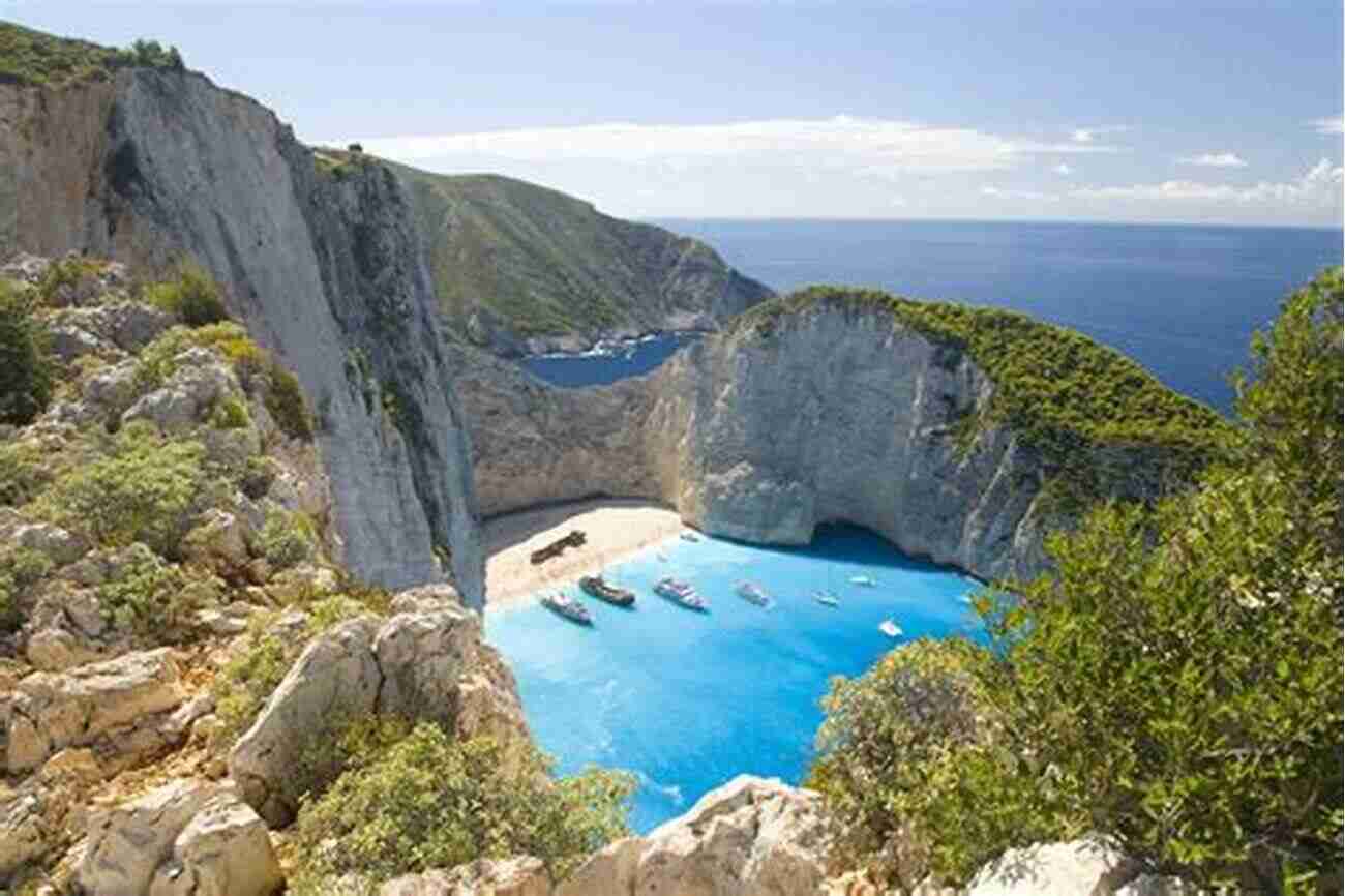 Relax On The Picturesque Navagio Beach Surrounded By Cliffs And Crystal Clear Waters Moon Greek Islands Athens Moon Greek Islands Athens: Timeless Villages Scenic Hikes Local Flavors (Travel Guide)