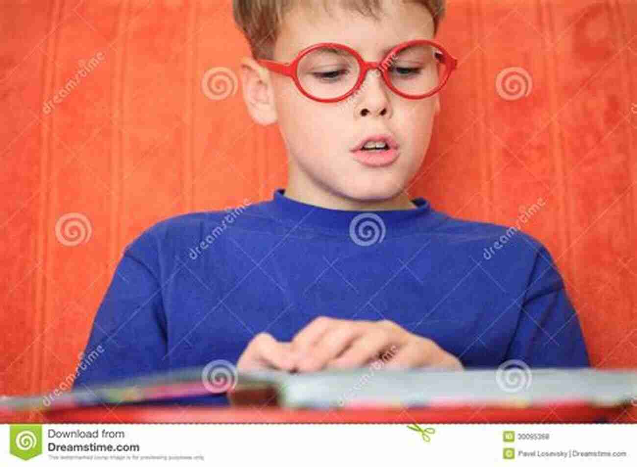 Smiling Little Boy Intently Reading A Book On A Sunny Day Literacy Development In The Early Years: Helping Children Read And Write (2 Downloads)